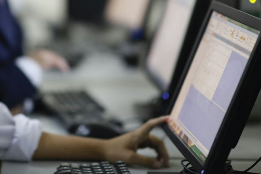 Person sitting at a computer workstation