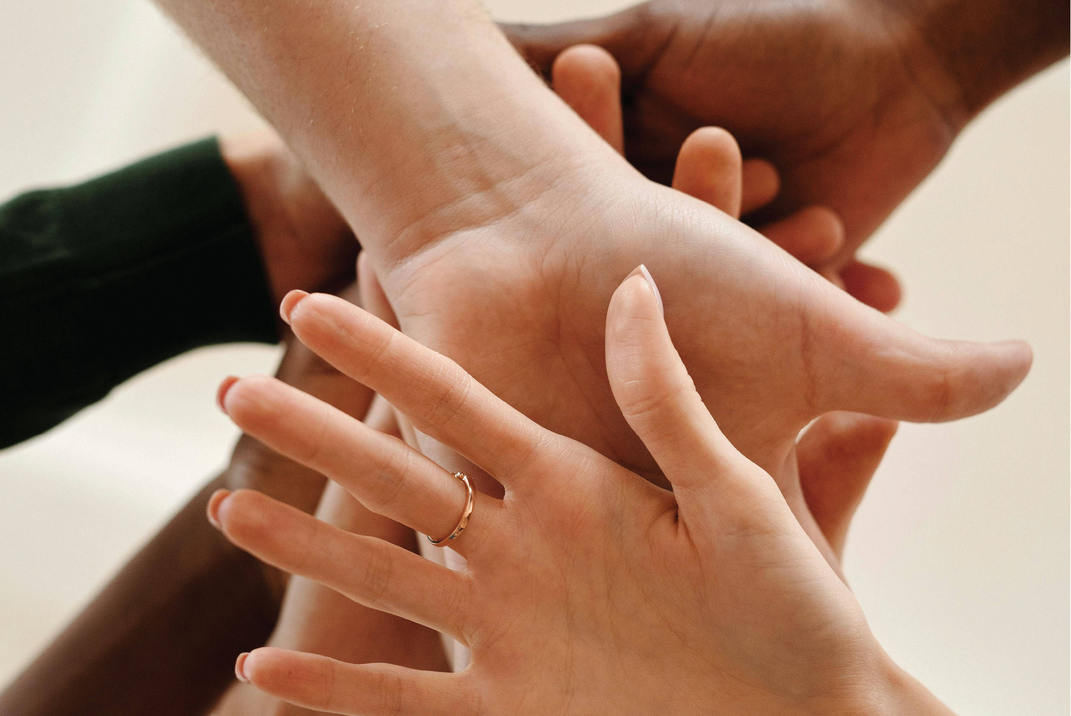 Hands stacked on top of each other