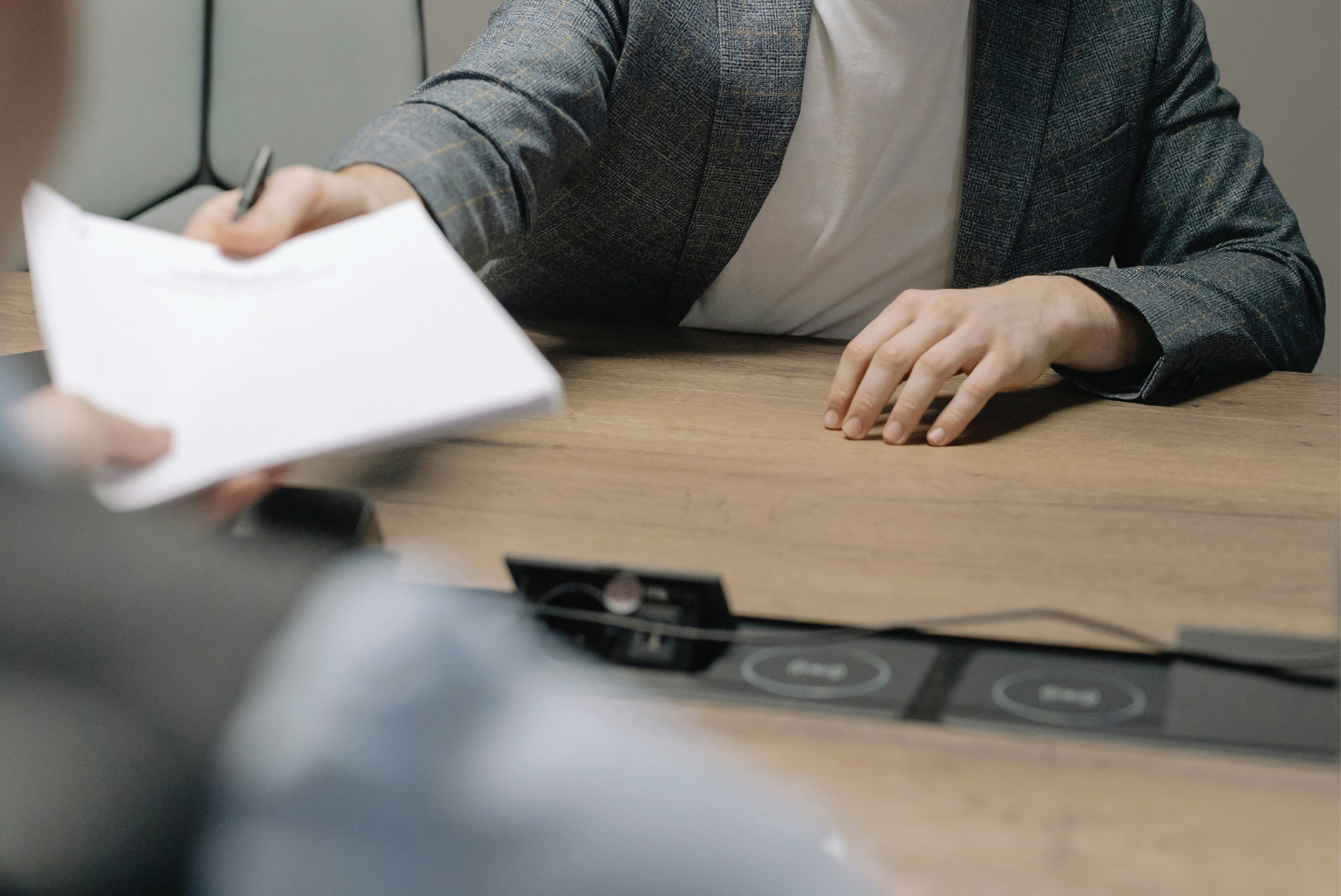 People passing papers